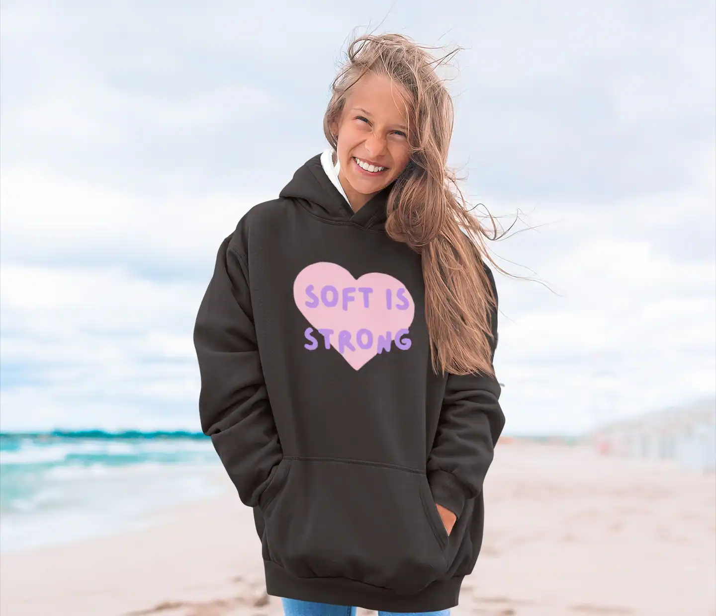 model wearing katseye soft is strong hoodie